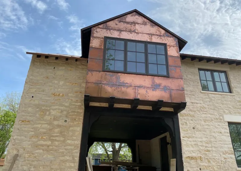 Copper metal panel facade on a stone building for Metal Roof Coating in Westmont